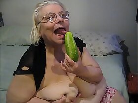A Of age coupled upon Pulchritudinous Obese Chick Teases upon a Cucumber